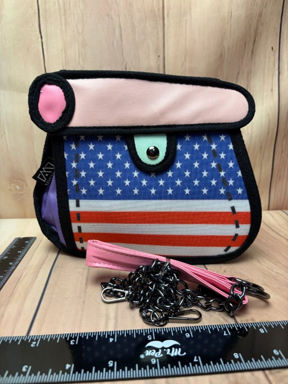 Fun small handbag featuring an American flag-inspired front design